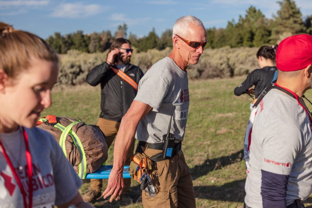 Man carrying stretcher.