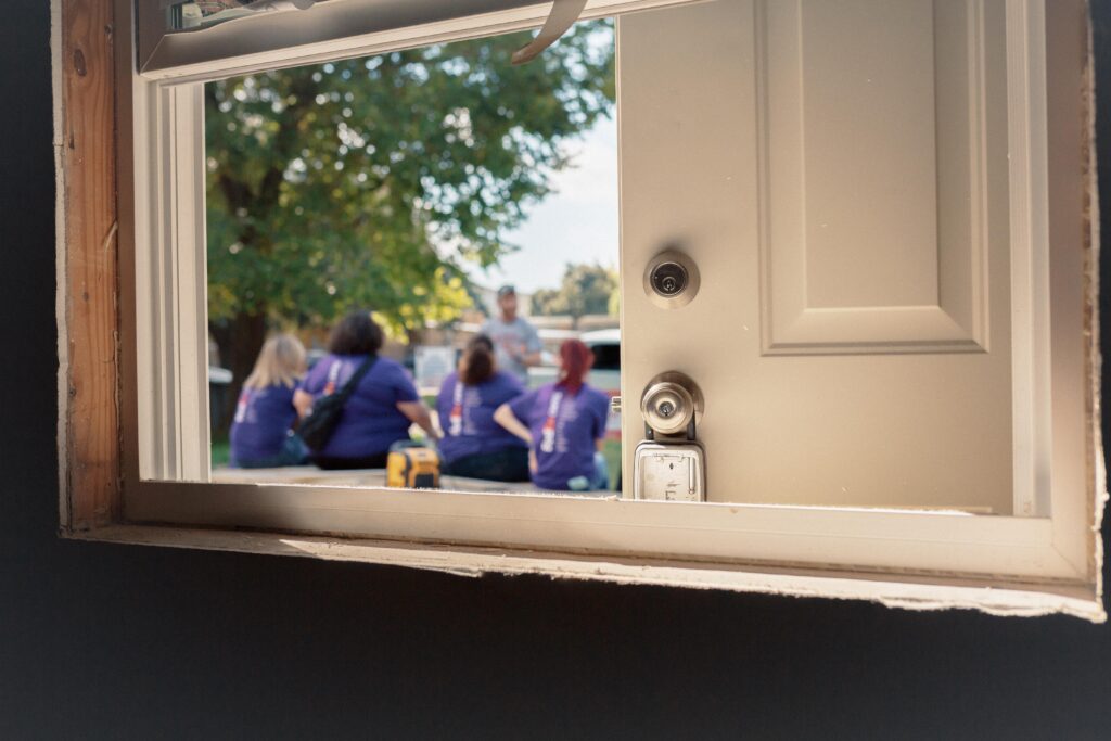 FedEx employees outside a house