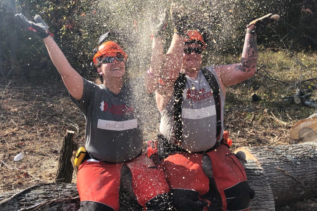 volunteers throw sawdust