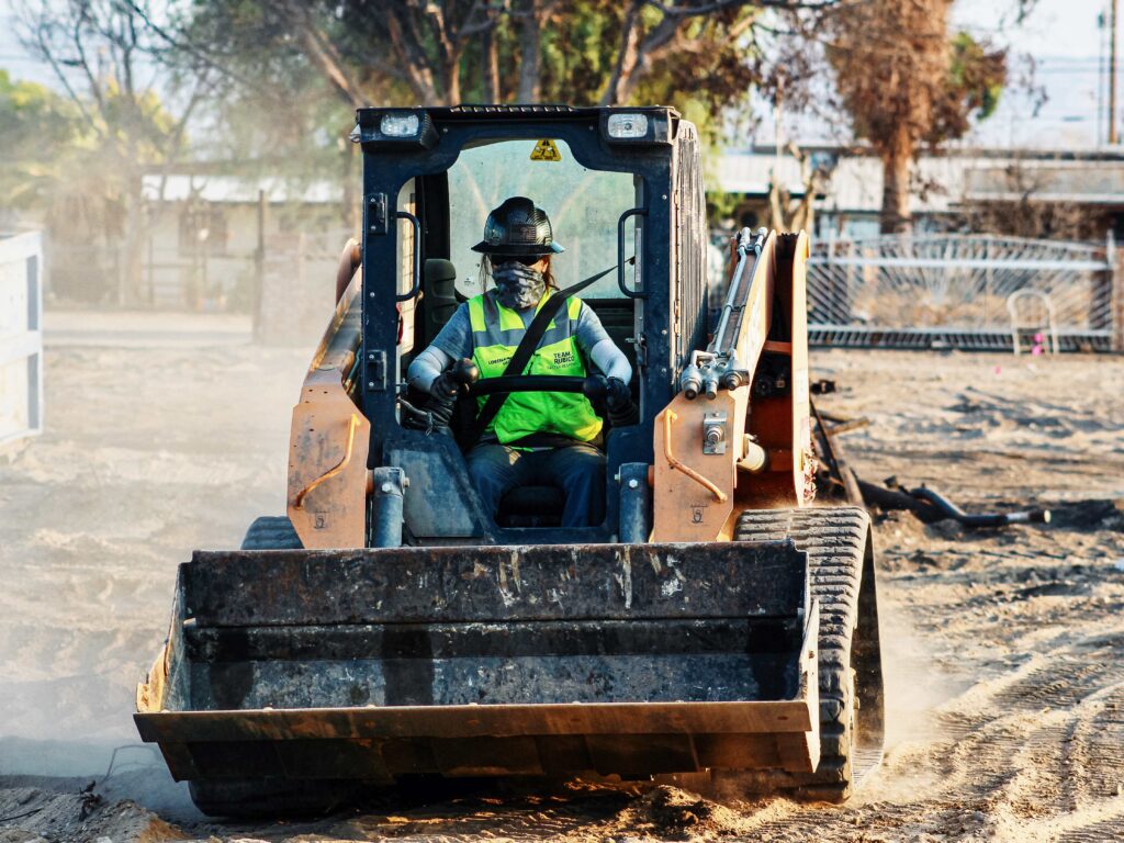 women in disaster relief heavy equipment operator