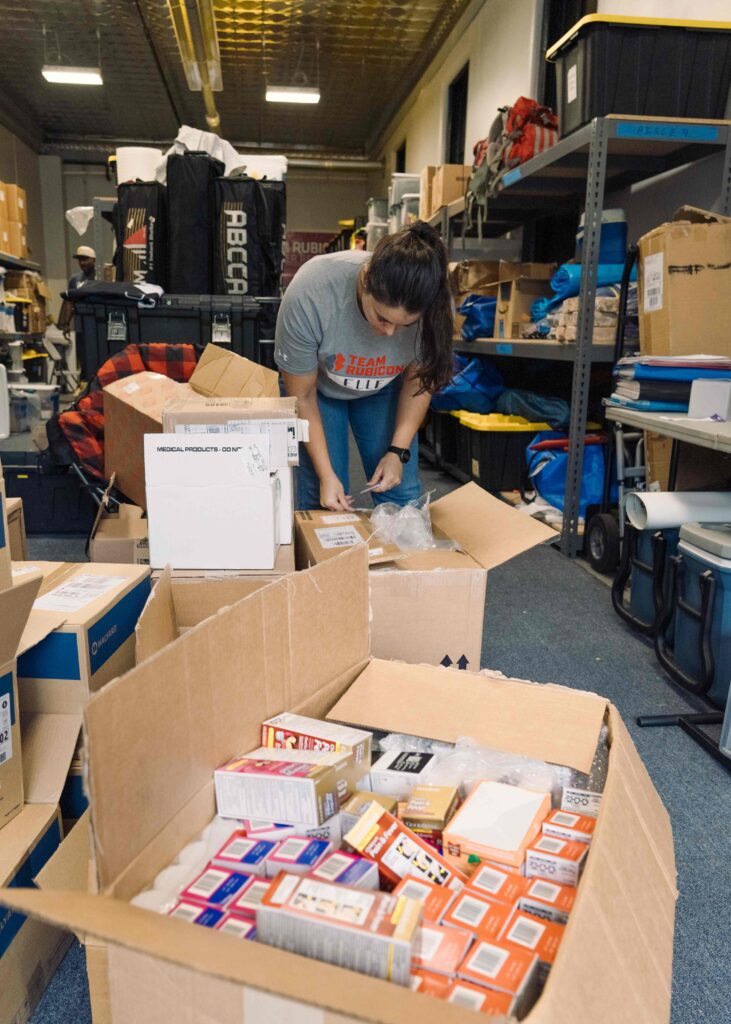 Venezuela earthquake volunteer packs supplies at TOC